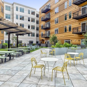 Courtyard courtyard with tables, chairs and garden boxes